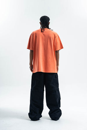 Psychedelic slogan t-shirt retro slogan top human print tee in orange