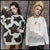 Pretty gen z girl wearing striped pattern fluffy jumper next to blonde punk guy model wearing shredded mesh knitted sweater in white